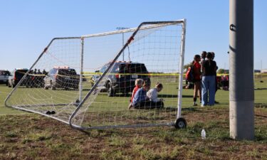 This image provided by KAKE shows police on the scene where a person drove a vehicle through a soccer field during a game in Wichita